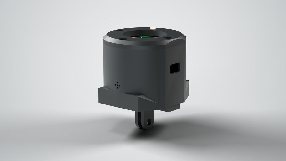 Wheelie Coach handlebar unit, charcoal, low side view: buzzer vent, USB-C charge port, GoPro-style mounting foot (render of the Rev 2.1 design)