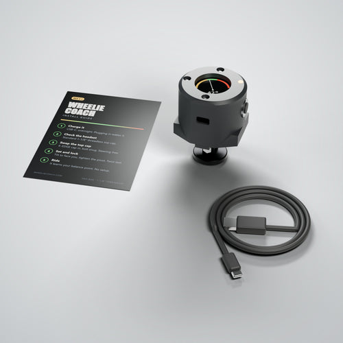 What's in the box: Wheelie Coach unit on its CNC aluminium top-cap mount, USB-A to USB-C charge cable, and the install guide